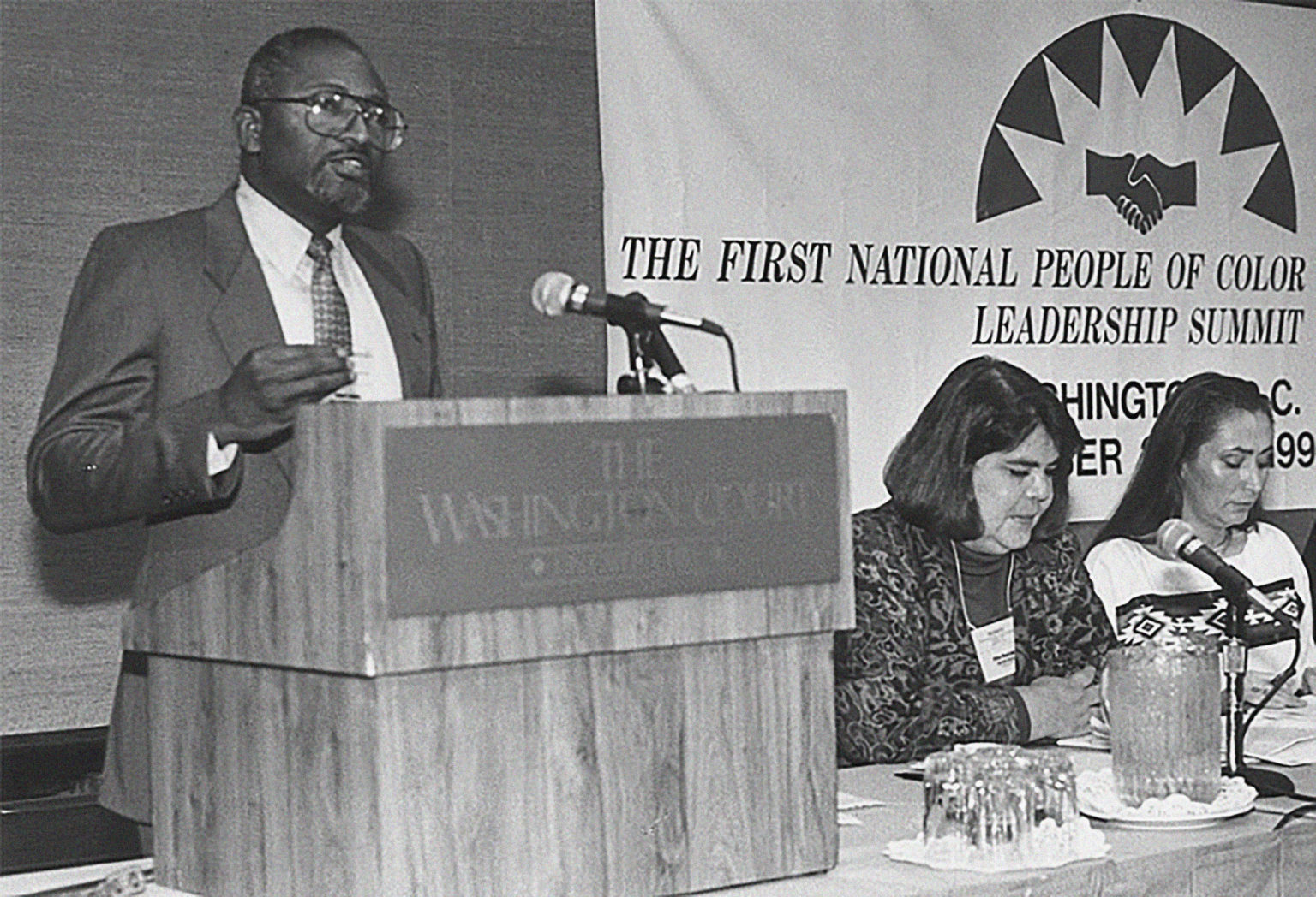 Dr. Robert D. Bullard delivering speech at podium.