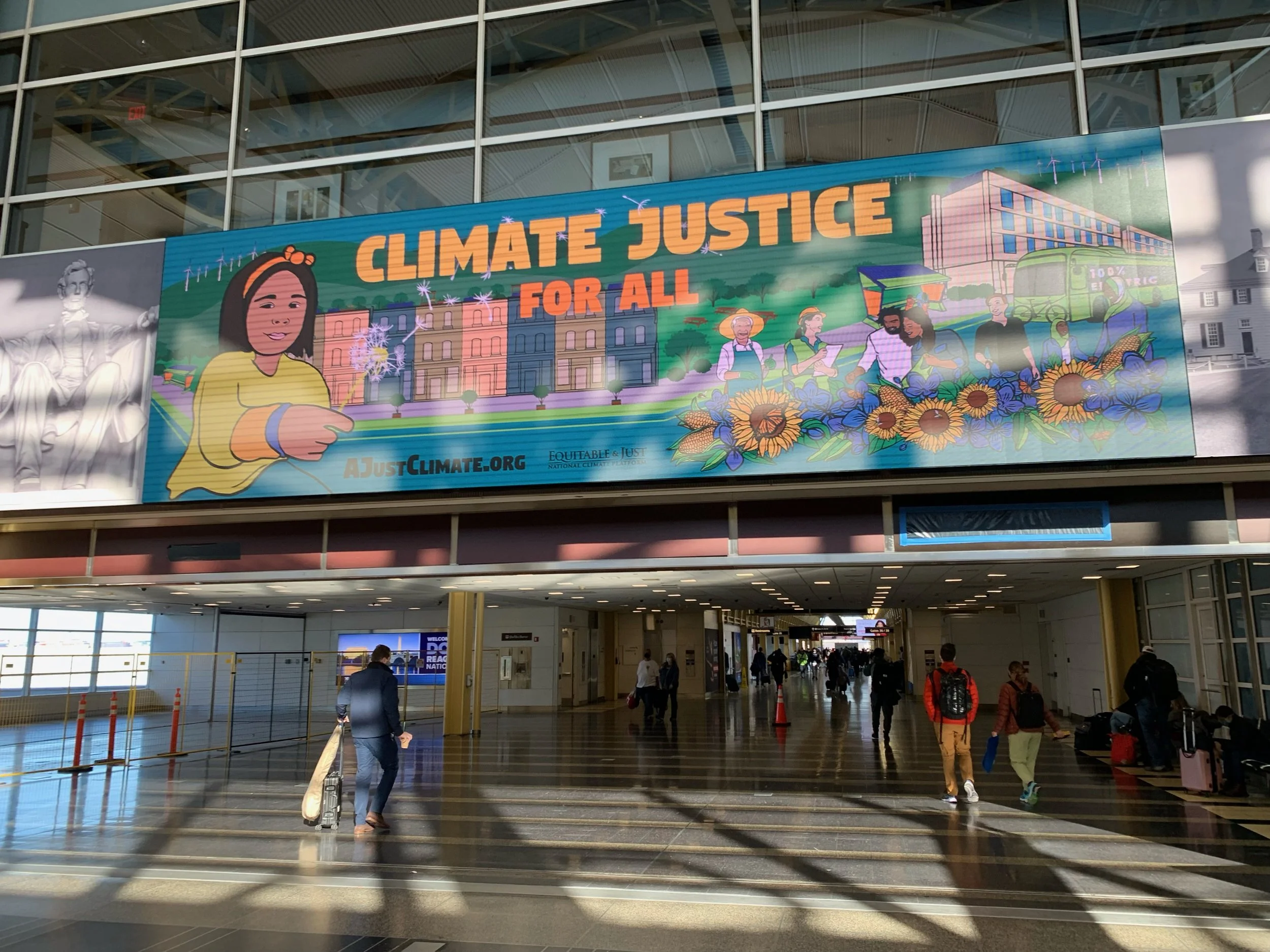 Colorful mural reading Climate Justice for All